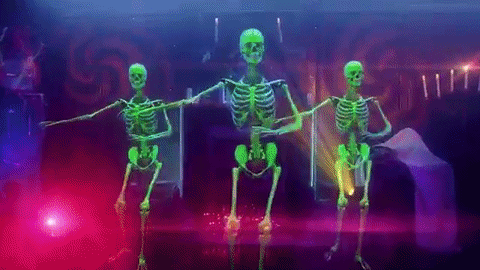 a gif of Skeletons dancing at a rave
